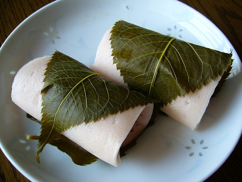 A_rice_cake_filled_with_sweet_bean_paste_and_wrapped_in_a_pickled_cherry_leaf,katori-city,japan